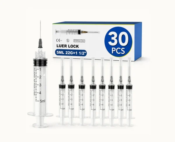 Box labeled 30 PCS of Luer Lock syringes with 5 mL capacity and 22G; several transparent syringes aligned in front.