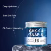 Blue jar of GHK-CU SNAP-8 Day & Night Cream on a rocky surface, with labels noting Deep Hydration, Even Skin Tone, and Oil-Control Moisturizing.