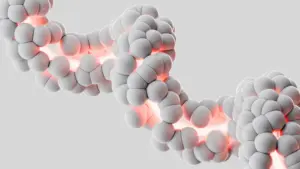 Abstract 3D spheres forming a twisting molecular-like chain with red glow, suggesting molecular structure or cellular connection.
